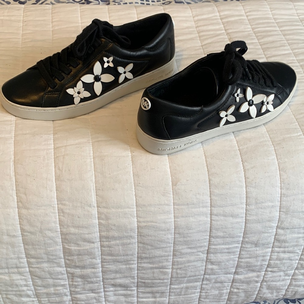 Michael Kors black with white flower detail sneakers, size 71/2.